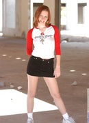 pale redhead poses outdoors